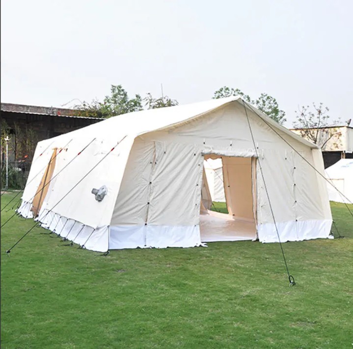 Inflatable relief tent deployed on green field